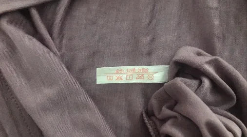 تنورة نسائية كاجوال أنيقة مثيرة مفتوحة الظهر كبيرة الحجم ذات قاعدة خلفية جميلة تنورة منزلية فضفاضة متقاطعة بأكمام طويلة